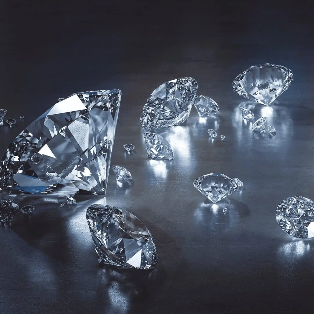 Sparkling diamonds scattered on reflective surface.