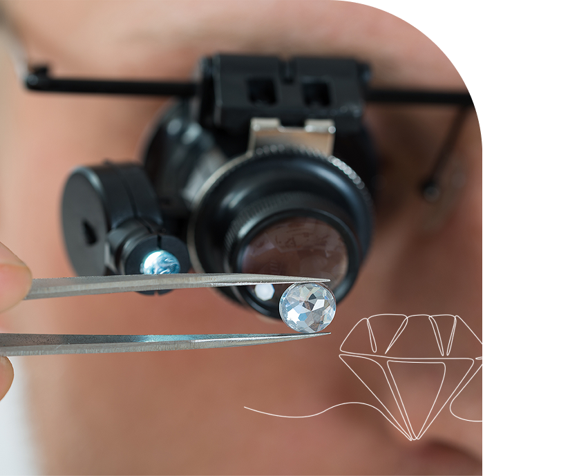 Jeweler examining diamond with magnifying tool.