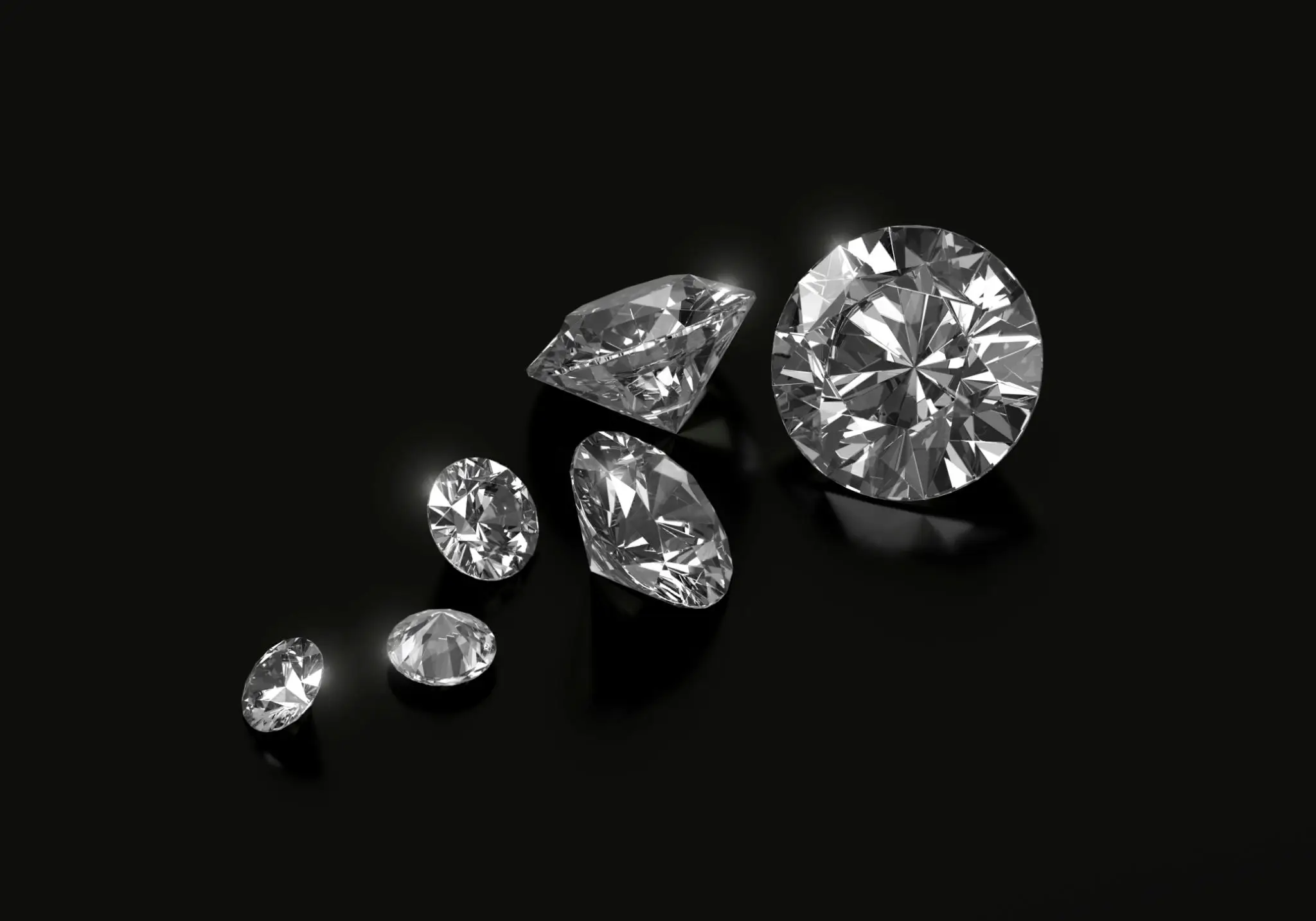 Shiny diamonds arranged on a black background.